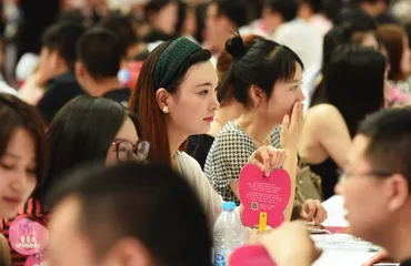 Young Chinese at speed dating event